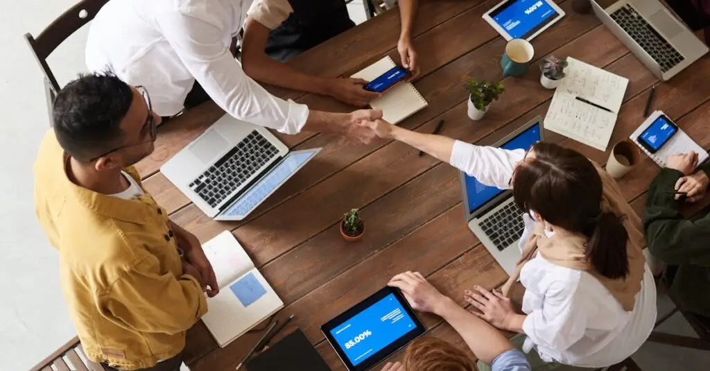Overhead shot of a diverse team collaborating in a modern office meeting.