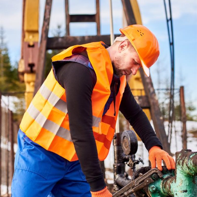 oil man tightening lug nuts with industrial wrench 2023 11 27 05 13 55 utc 1.jpg